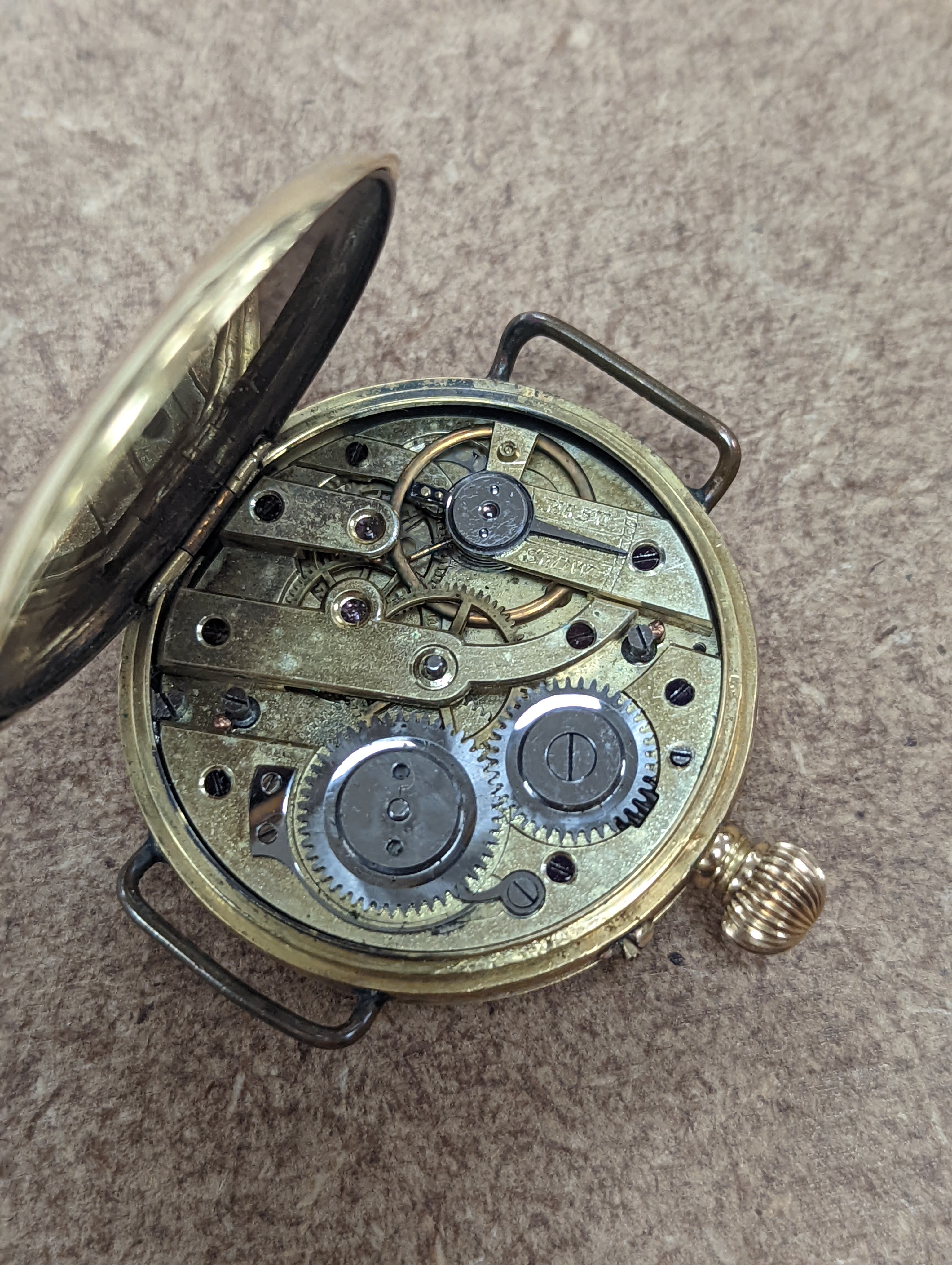 A gentleman's early 20th century continental 18k half hunter wrist watch, case diameter 33mm, gross weight 32.7 grams, together with two other silver watches.